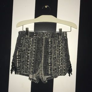 Black and tan design shorts with black lace